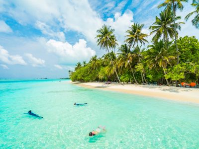 Beautiful tropical Maldives island with beach , sea , and coconut palm tree on blue sky for nature holiday vacation background concept -Boost up color Processing